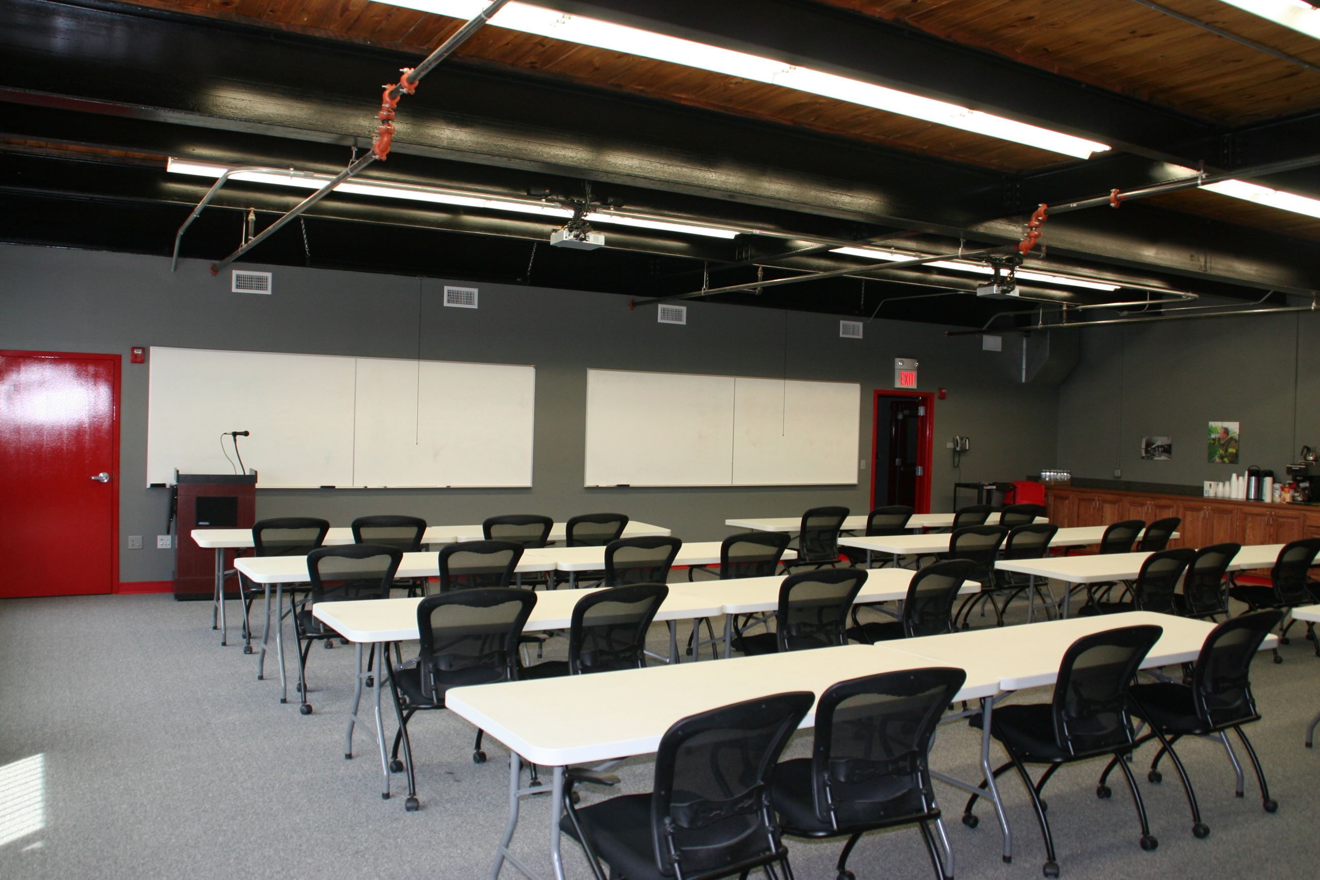 Paola Fire Department Large Training Room with tables and chairs set up.